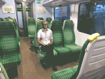 simon-on-train-leg-crossed