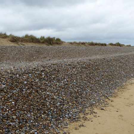 A high bank of shingle at Dunwich, Suffolk.