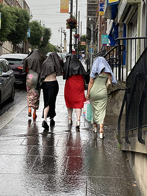 Women on a night out in a wet Derry.