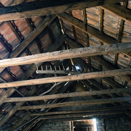 The roof rafters in an attic.