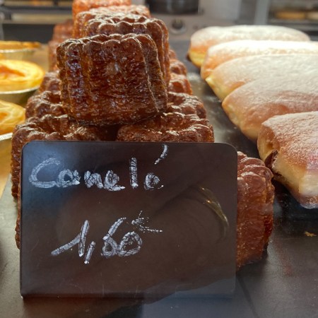 A shop display of caneles.