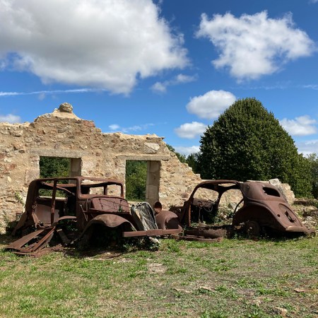 Wrecks of cars in Oradour-sur-Glane, France.