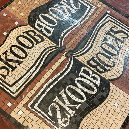 Skoob Books sign in tiles on the floor of the bookshop.