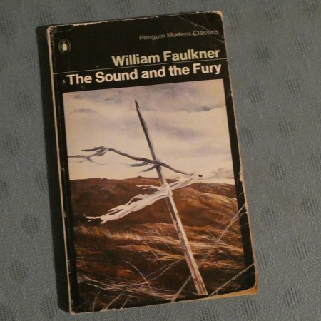 A copy of The Sound and the Fury by William Faulkner.