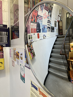 Stairs down to Skoob Books in London.