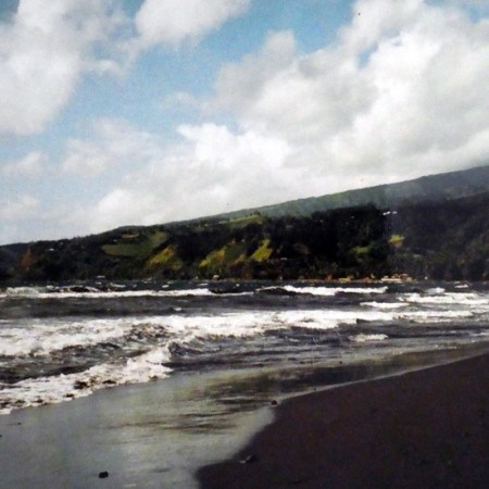 Black sand beach at Mahana, Tahiti, French Polynesia.